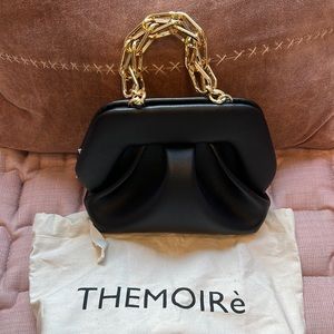Themoire Bios clutch in black.
